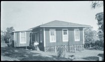 Father Otto (Wulfram) Duchting, SS.CC., in front of his residence, Honokaa, Hawaii Island.